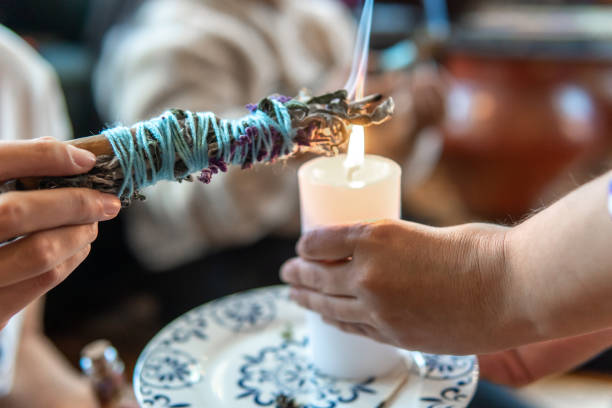 Close-up of hands burning cinnamon and lavender in a healing ceremony. High quality photo